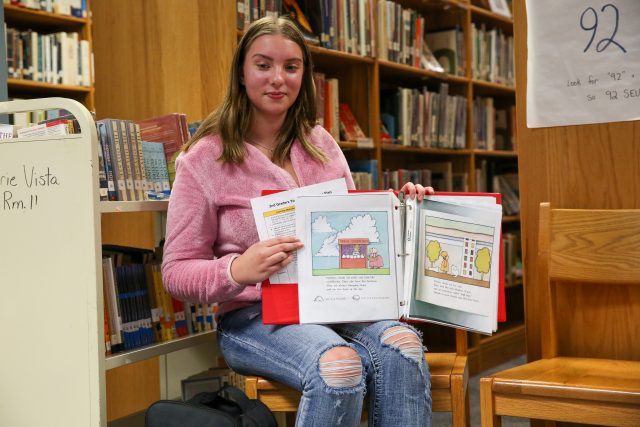 student reading book