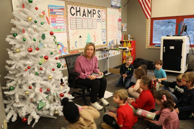 Mrs. Truckowski reading to students